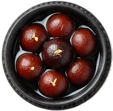 a bowl filled with chocolate covered balls.jpg